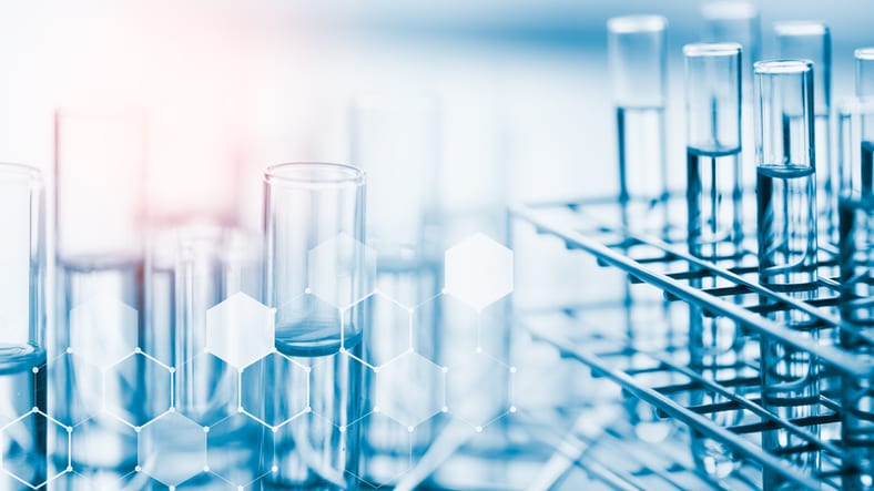 Laboratory glassware containing chemical liquid, science background